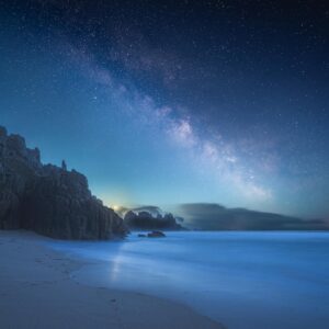 The milky way visible in the pre-dawn sky at Pednvounder Beach, Porthcurno Cornwall.
