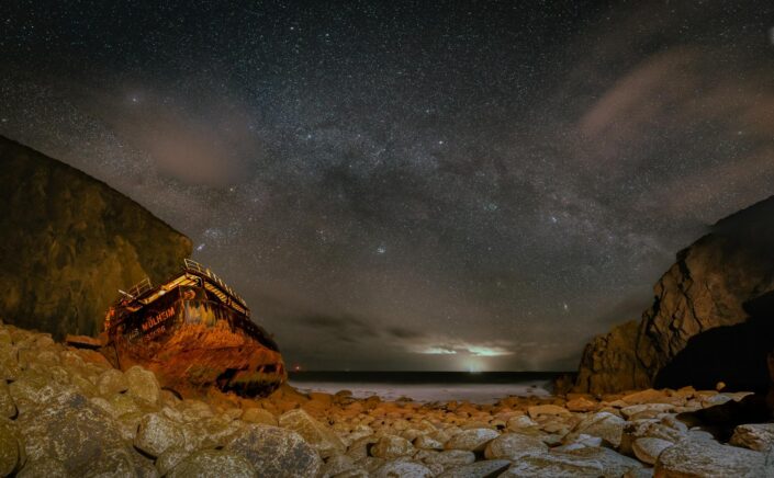 The shipwreck of the RMS Mulheim in Cornwall under the milky way.