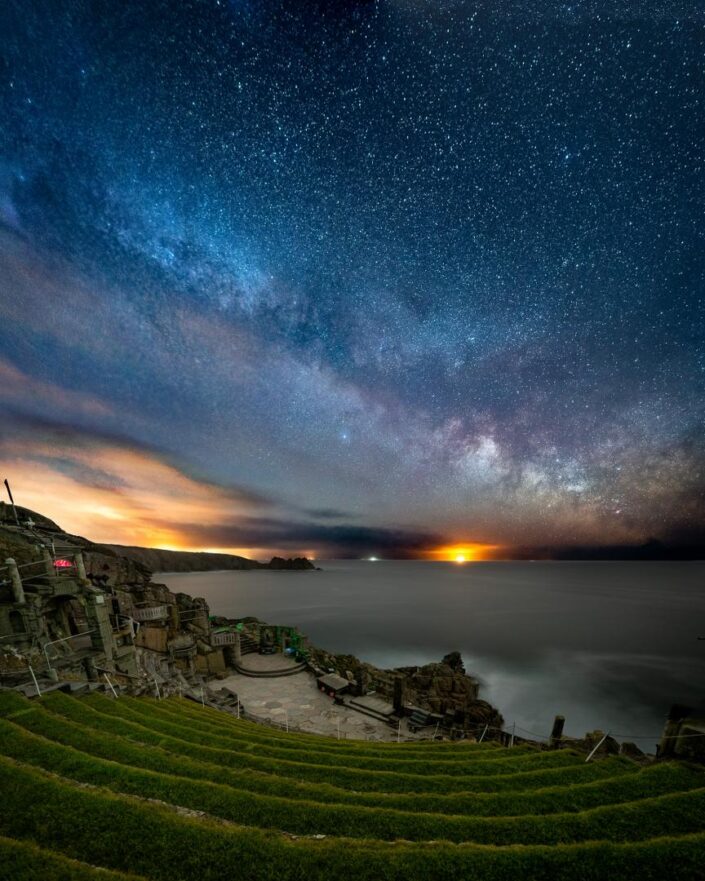 The milky way rising over the Minack Theatre at Porthcurno, Cornwall